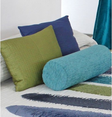 Coussin polochon jacquard Pehuen turquoise