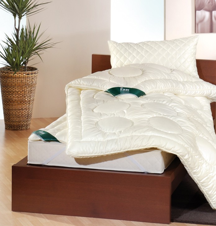 Surmatelas laine Derby sur un matelas